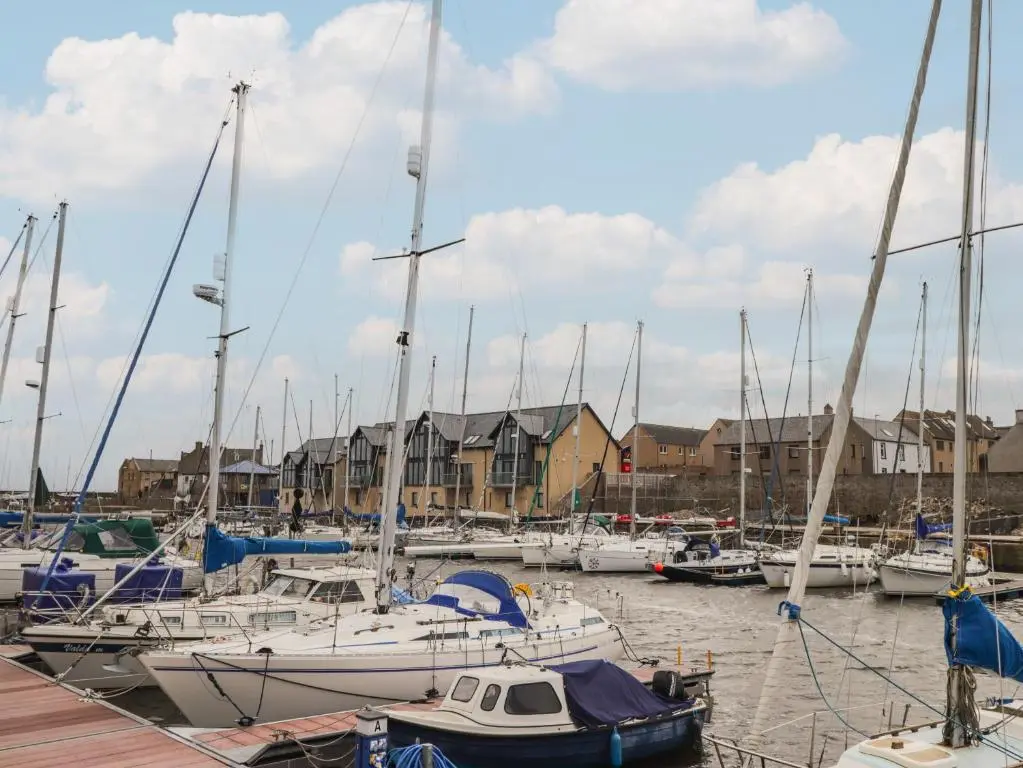 a bunch of boats docked in a harbor at Spinnaker in Lossiemouth