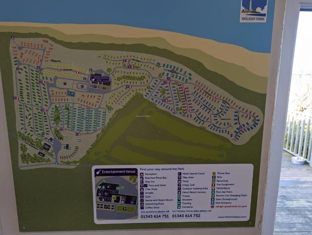 a sign with a map of a resort at D11 - the Dunes at Silver Sands in Lossiemouth