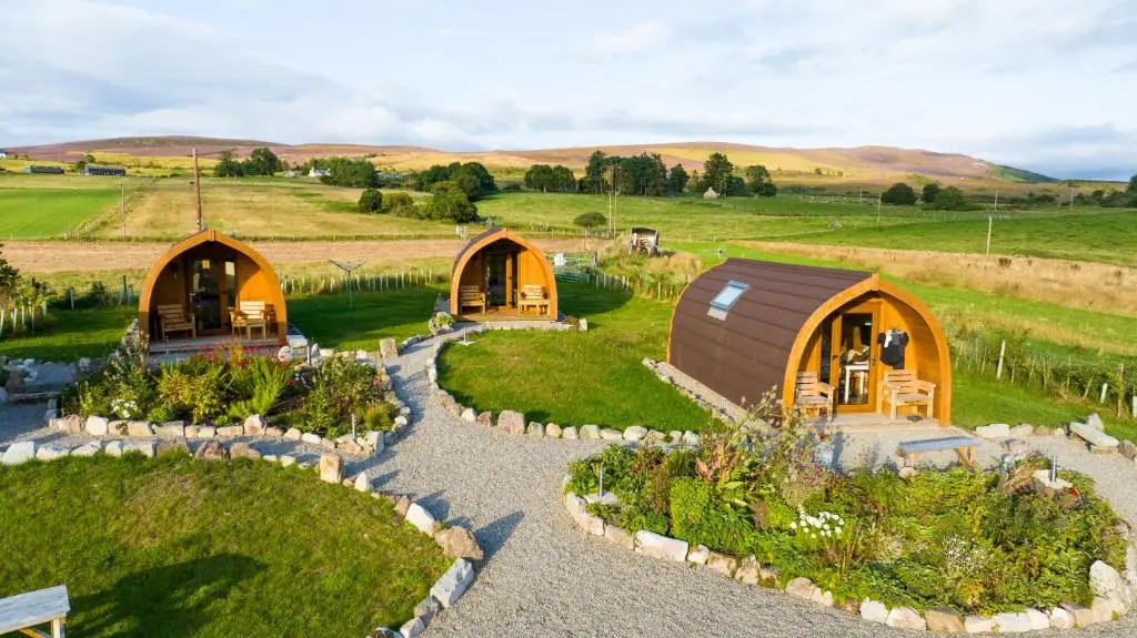 an aerial view of a garden with two domes at Migdale Pods Luxury Glamping in Bonar Bridge
