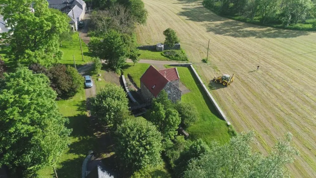 an aerial view of a house in a field at Stunning Rural Mill House nr beach and harbour in Banff