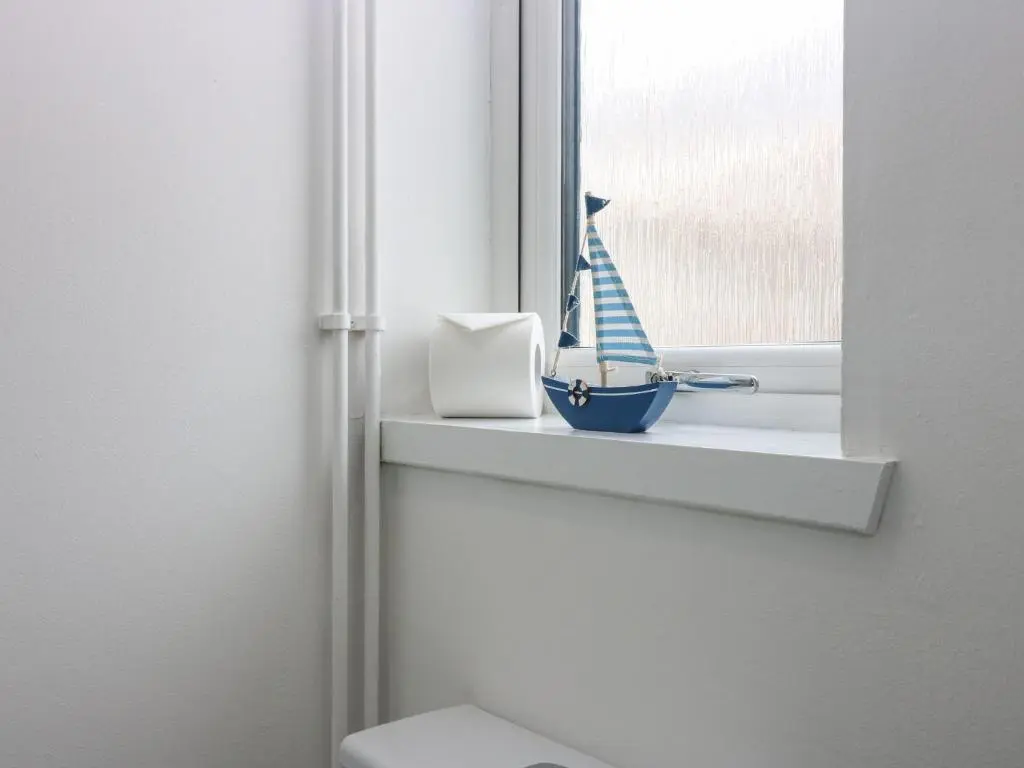 a window sill with a figurine of a boat on it at 2 College Bounds in Fraserburgh