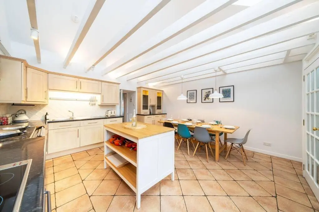 a kitchen with a table and a dining room at Westerpark Cottage, Pet & Family Friendly Countryside Retreat, Aberdeenshire in Huntly