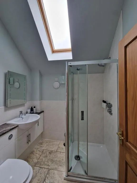 a bathroom with a shower and a sink at Lodges at the Mains in Inverness