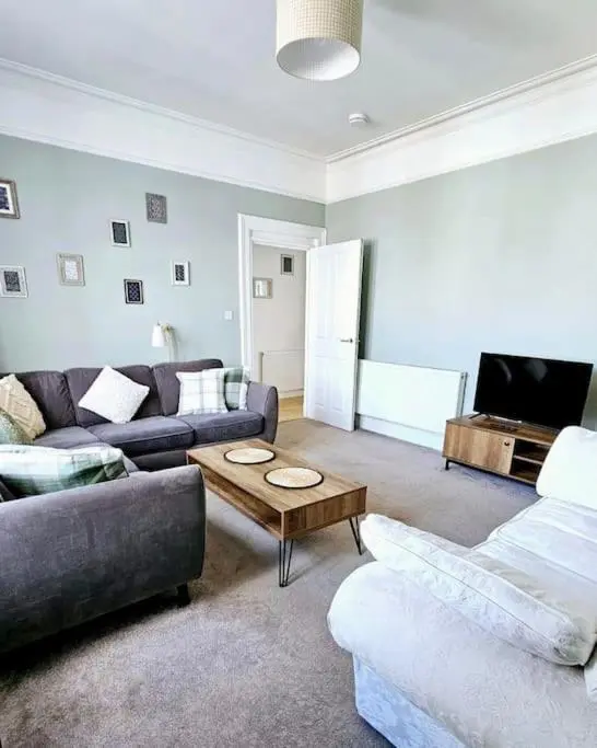 a living room with two couches and a coffee table at Charming 3-bedroom maisonnette in Inverness City Centre in Inverness