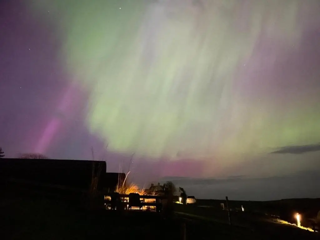 an aurora in the sky over a building at Faodail 'a lucky find' in Dunbeath