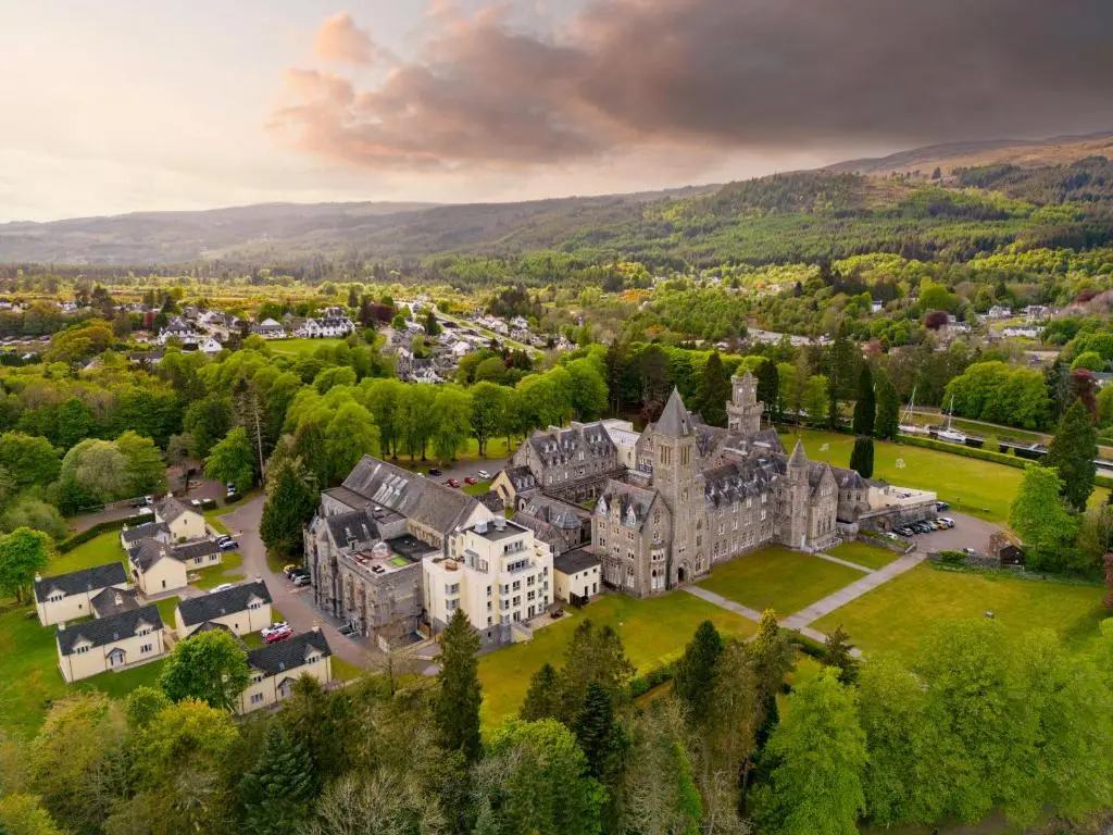 an aerial view of a large castle in a city at Courtyard Cottage 3, Riverside Cottage in Fort Augustus