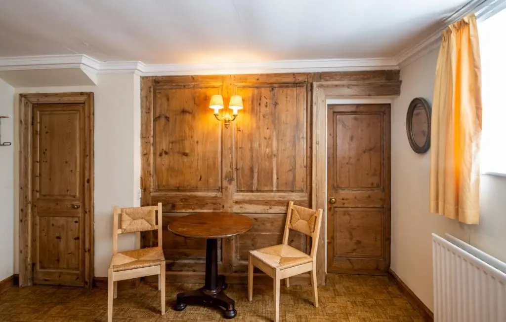 a dining room with a table and two chairs at 7 Shorehead, Portsoy in Portsoy
