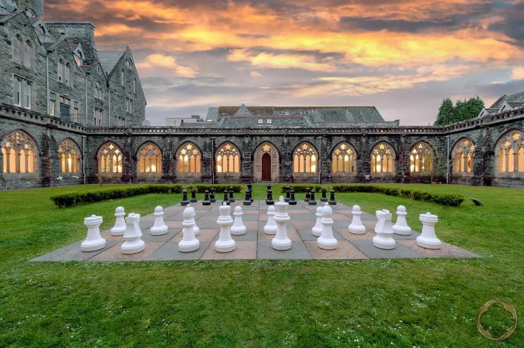 a large chess set in front of a building at Highland Club Direct in Fort Augustus