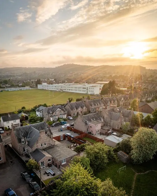 an aerial view of a town with houses and a field at Lachie's Townhouse in Inverness