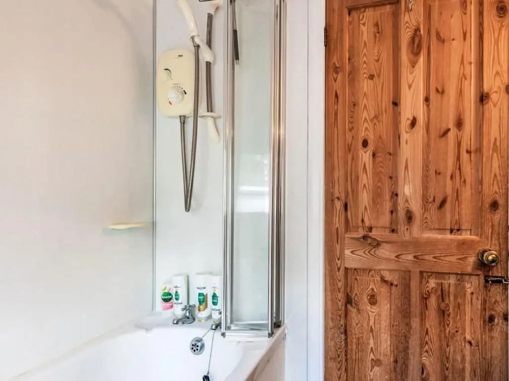 a bathroom with a shower and a sink with a mirror at Holiday Home Dancot by Interhome in Invermoriston