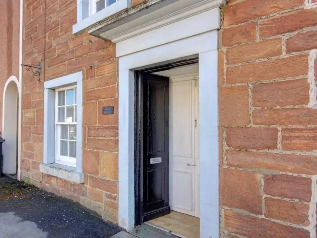 a door in the side of a brick building at Anvil House, Golspie in Golspie