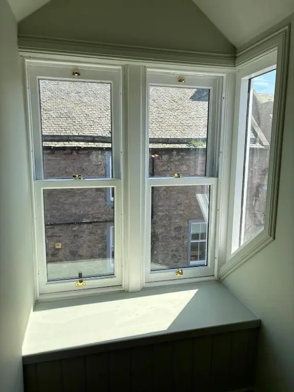 a window in a room with three windows at Hootananny in Inverness