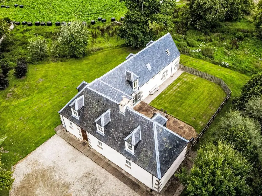 an aerial view of a house with a solarium at Holiday Home Old Stables by Interhome in Drumnadrochit