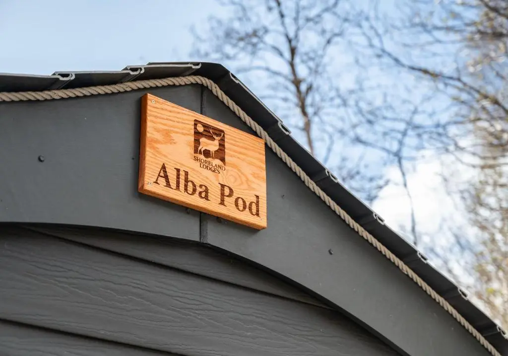 a sign on the side of a building at Alba Pod in Fort Augustus