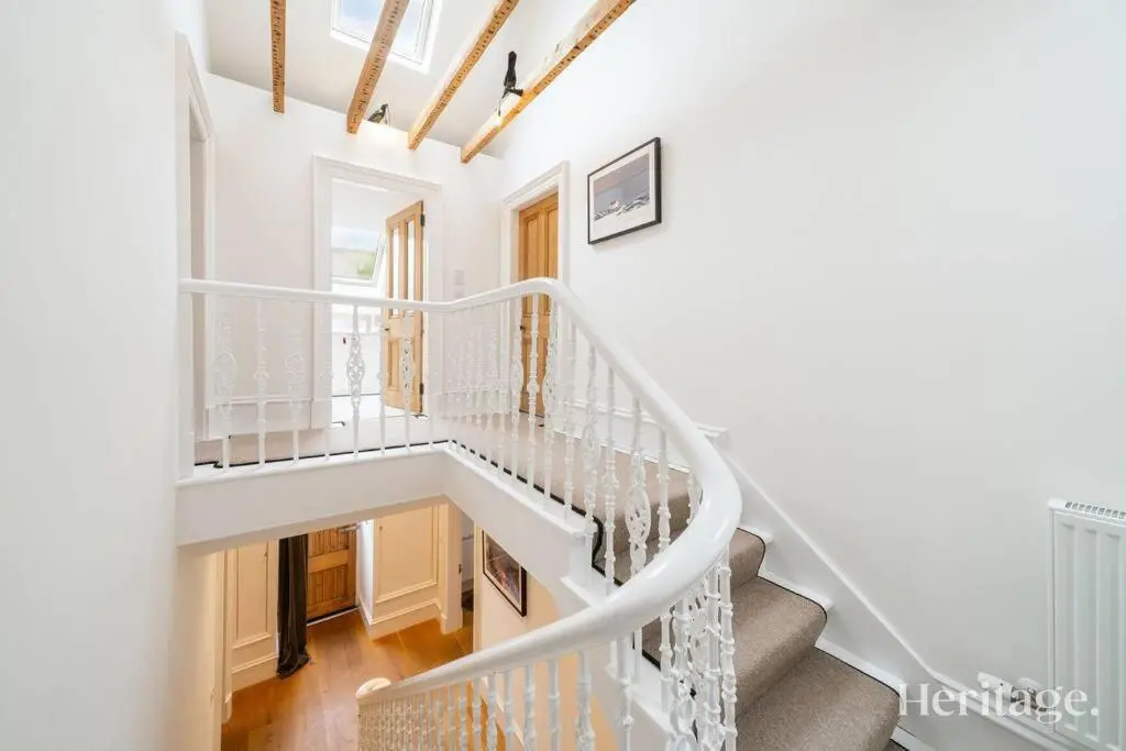 a staircase in a home with white walls at Kirkton Family Farmhouse with Hot Tub, Alford, Aberdeenshire in Alford