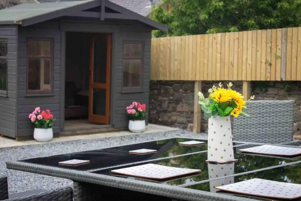 a pretend play house with flowers on a table at Crannoch Self Catering - 10 bedroom former hotel in Cullen