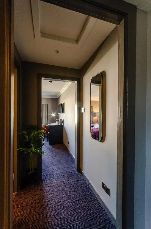 a hallway leading to a room with a living room at Sweeney Aviemore Two in Aviemore