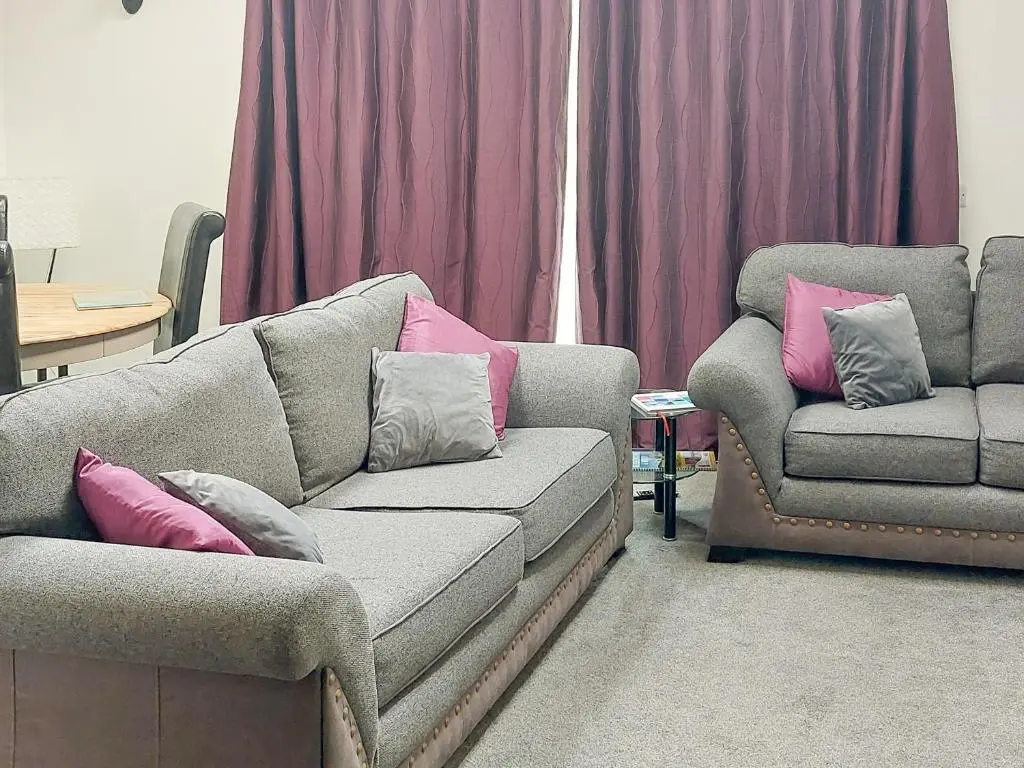 a living room with a couch and a chair at Mountshade in Finzean