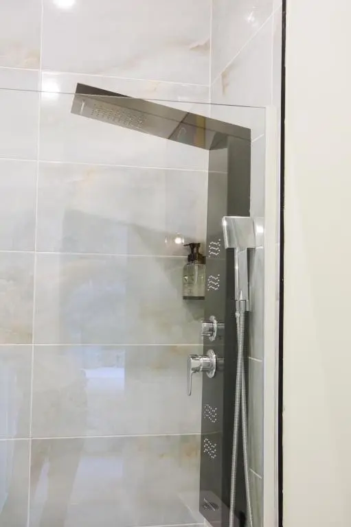 a glass door to a shower in a bathroom at Inbhir Nis City Apartment in Inverness