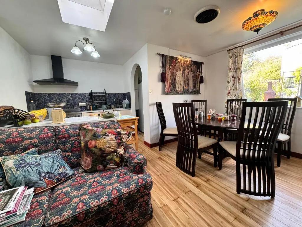 a living room with a couch and a table at Selkie House Song of the Sea in Helmsdale