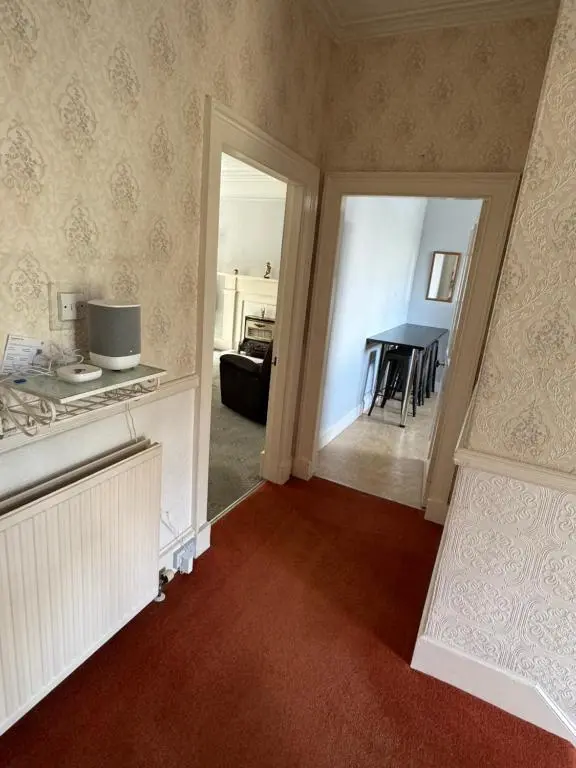 a room with a kitchen and a dining room at Spacious Harbour House in Wick