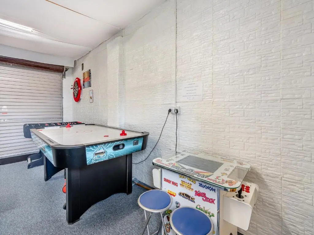 a play room with a ping pong table and a ping pong table at Croftside House - S4401 in Inverdruie