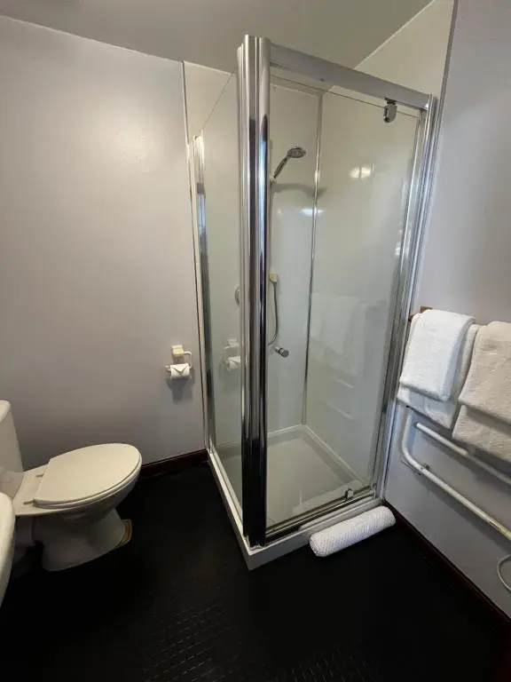 a bathroom with a shower and a toilet at The Stag Hotel in Banchory