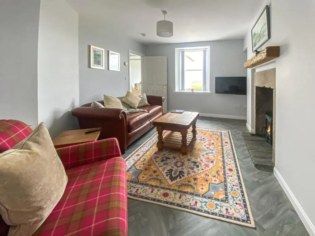 a living room with a couch and a coffee table at Guise Cottage Uk46303 in Tough