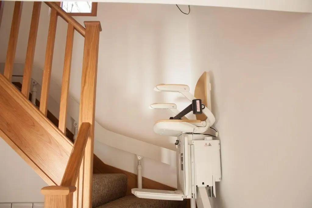 a hospital room with a hair dryer next to stairs at Carn Na Drochaide in Braemar