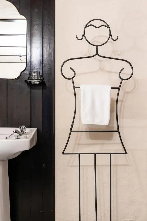 a towel rack next to a sink in a bathroom at Criss Cross Cottage in Inverness