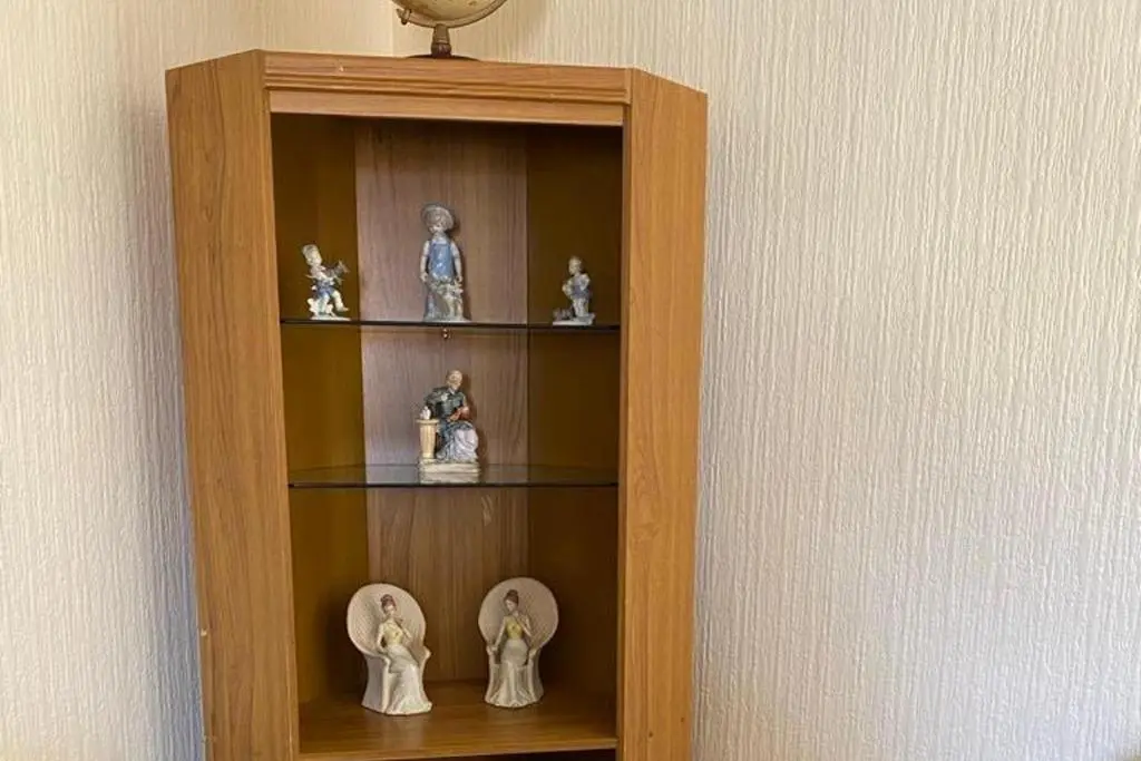 a wooden book shelf with figurines in it at 2 Bed Cottage Sleeps 4-Pets Welcome-Private Garden in Buckie