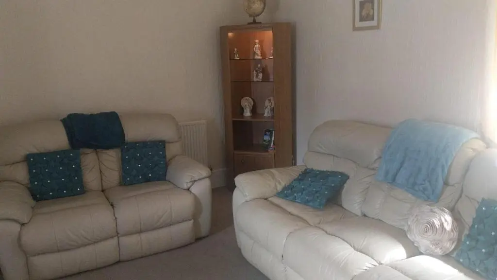 a living room with two chairs and a couch at 2 Bed Cottage Sleeps 4-Pets Welcome-Private Garden in Buckie