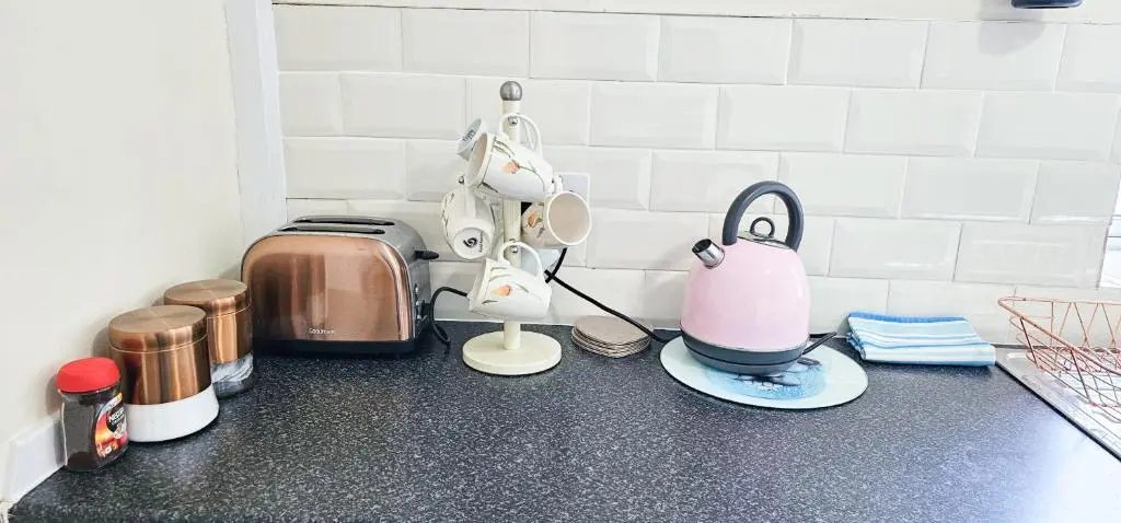 a kitchen counter with a toaster and other kitchen appliances at 1 Bedroom House - Inverness - River Canal in Inverness