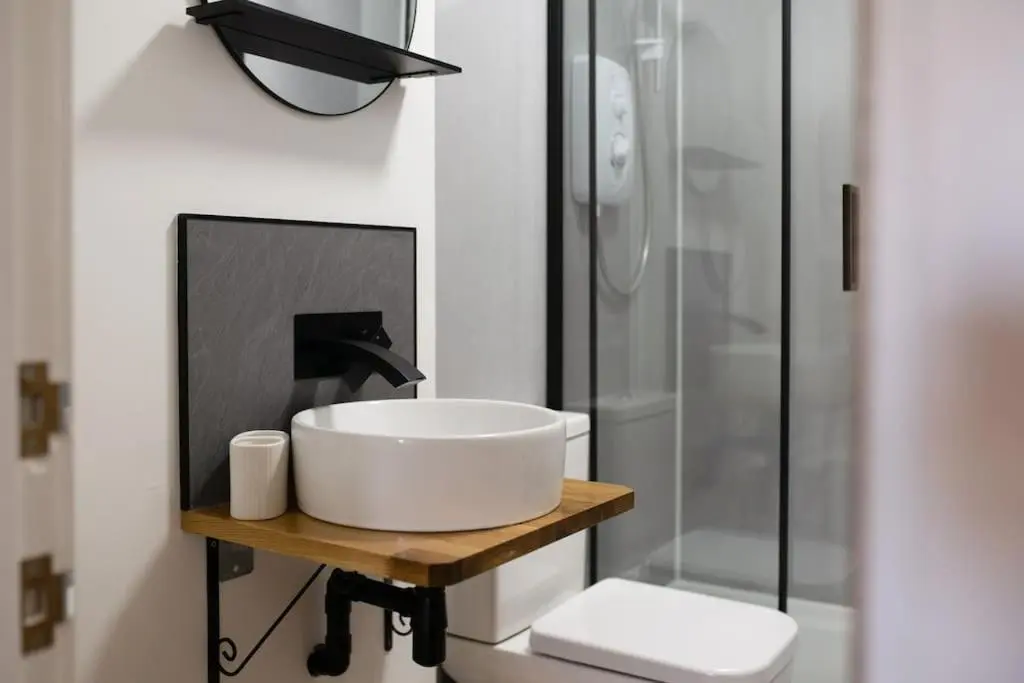 a bathroom with a sink and a shower at Town centre flat in Inverness