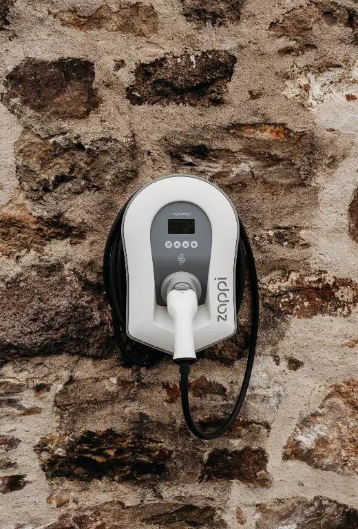 a black and white phone on a stone wall at No1 Burgie Mains Cottage in Forres
