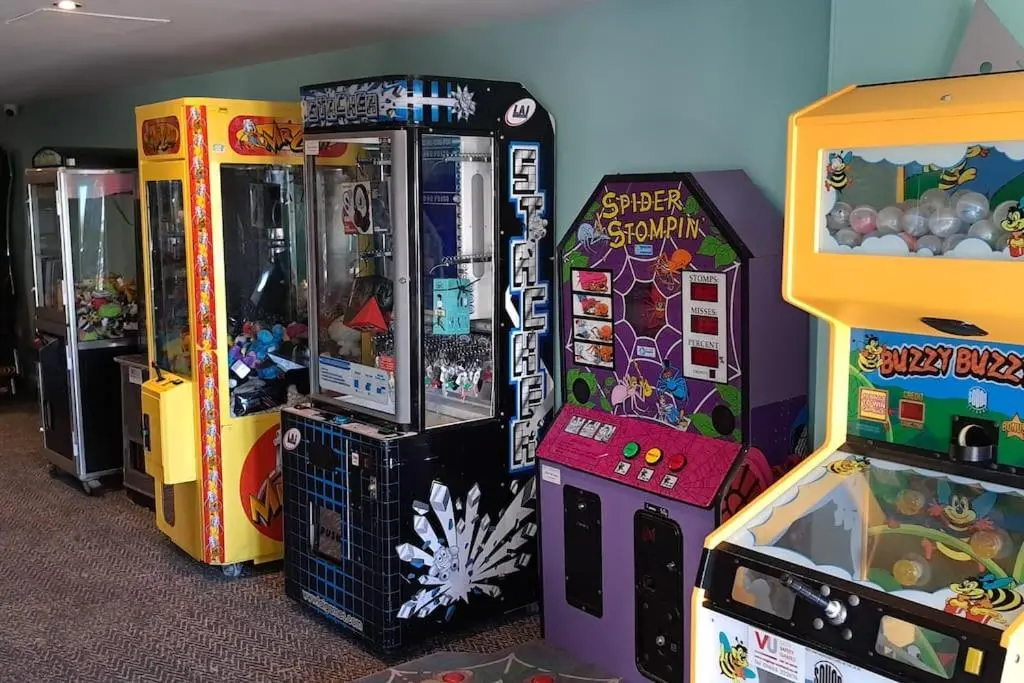a group of arcade games lined up next to each other at Coral Cove in Lossiemouth