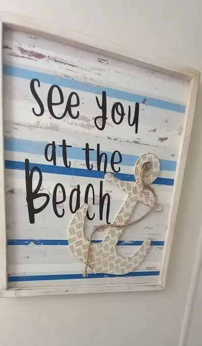 a sign that says see you at the beach at Coral Cove in Lossiemouth