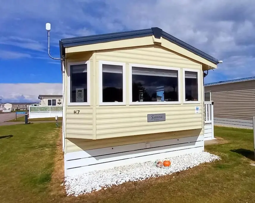 a tiny house sitting in a yard at Coral Cove in Lossiemouth