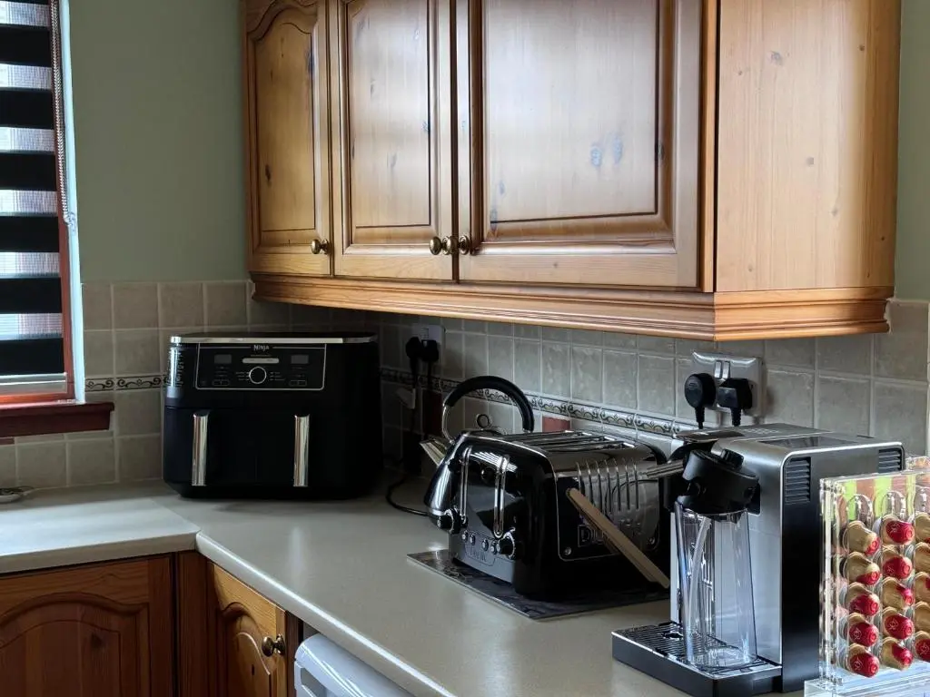 a kitchen counter top with a toaster and a toaster at Oaklyn,Highland Village of Beauly, Quiet Neighbourhood, One Bed, Min 5 nights in Beauly