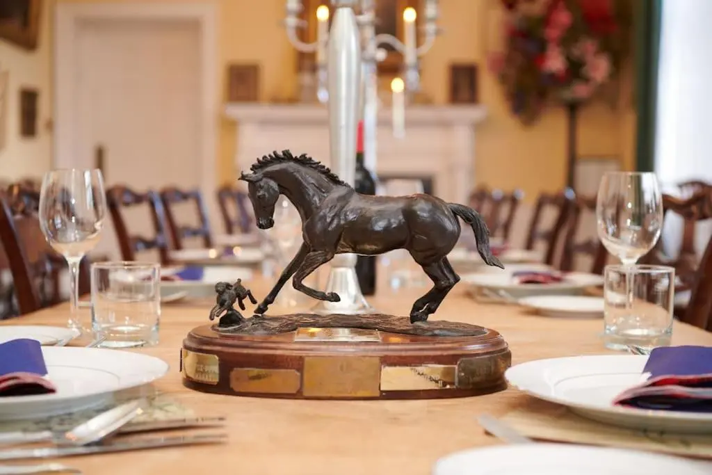 a bronze horse statue sitting on top of a table at Idyllic 12 bedroom Country Home in Forres