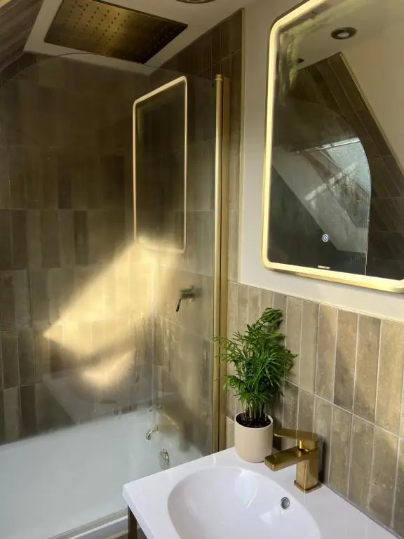 a bathroom with a sink and a shower and a mirror at Lewis Lodge - Stunning & Exclusive Luxury Home in the Heart of Ballater, Royal Deeside in Ballater