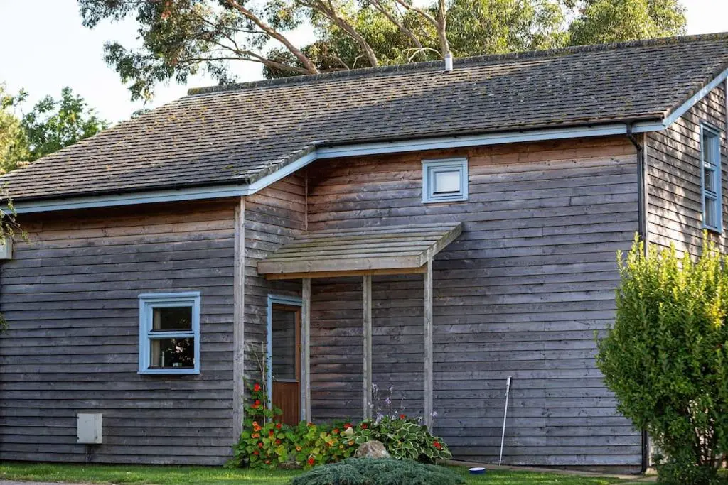 a small wooden house with a window at Findhorn Bay - Sandpiper Eco chalet in Findhorn