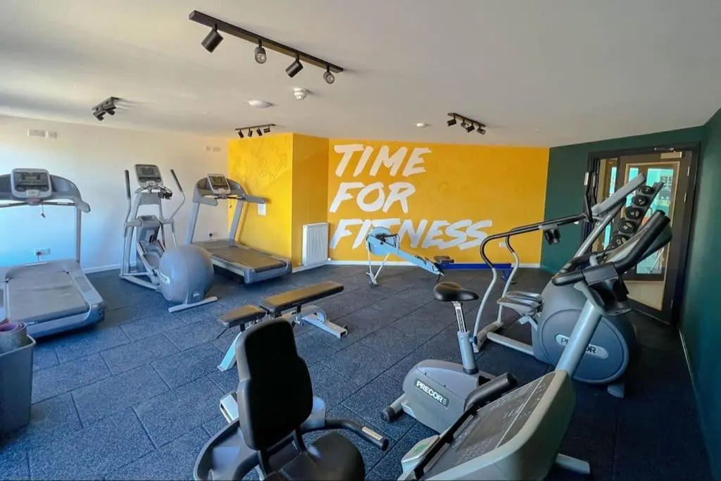 a gym with several exercise bikes in a room at Sea La Vie Caravan at Silver Sands Holiday Park in Lossiemouth