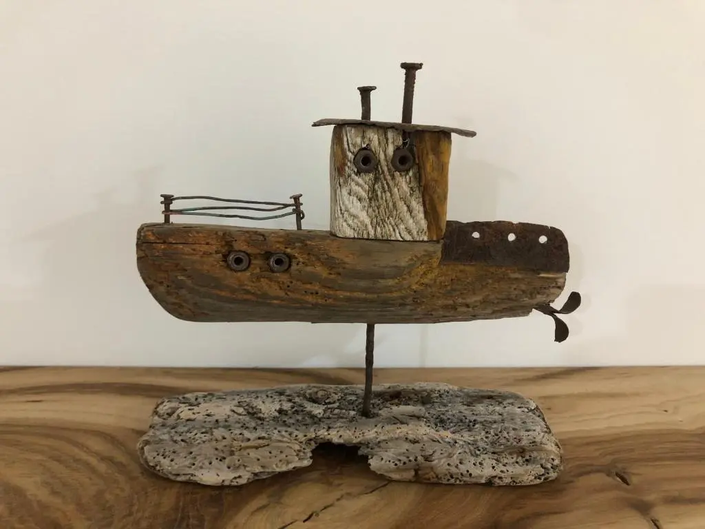 a wooden boat sitting on top of a wooden floor at The Three Kings Inn in Cullen