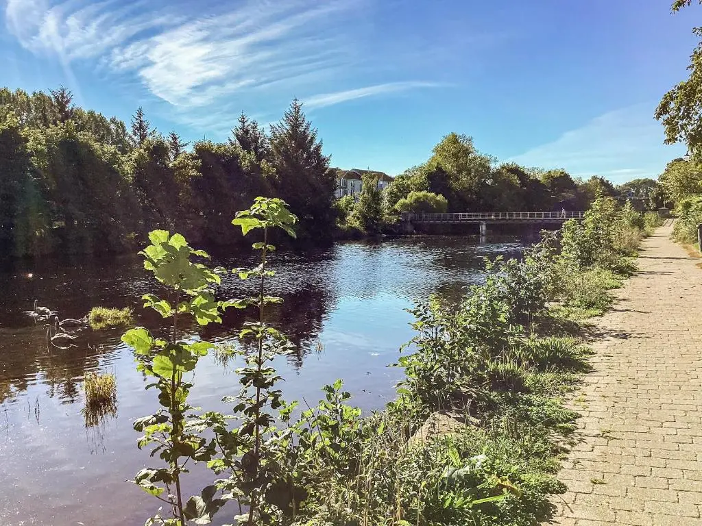 a view of a river with a bridge in the background at Taigh Na Tunnagan in Nairn