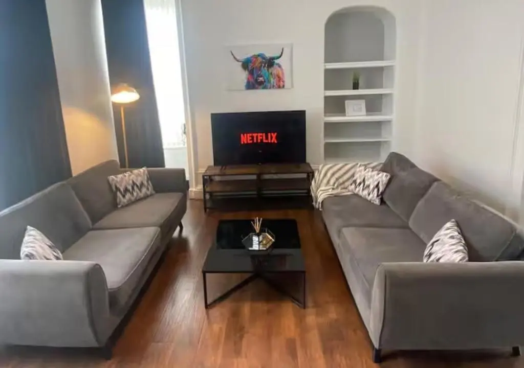 a living room with two couches and a tv at Frithside Retreat 3BR Sleeps 7 Coastal Getaway in Fraserburgh