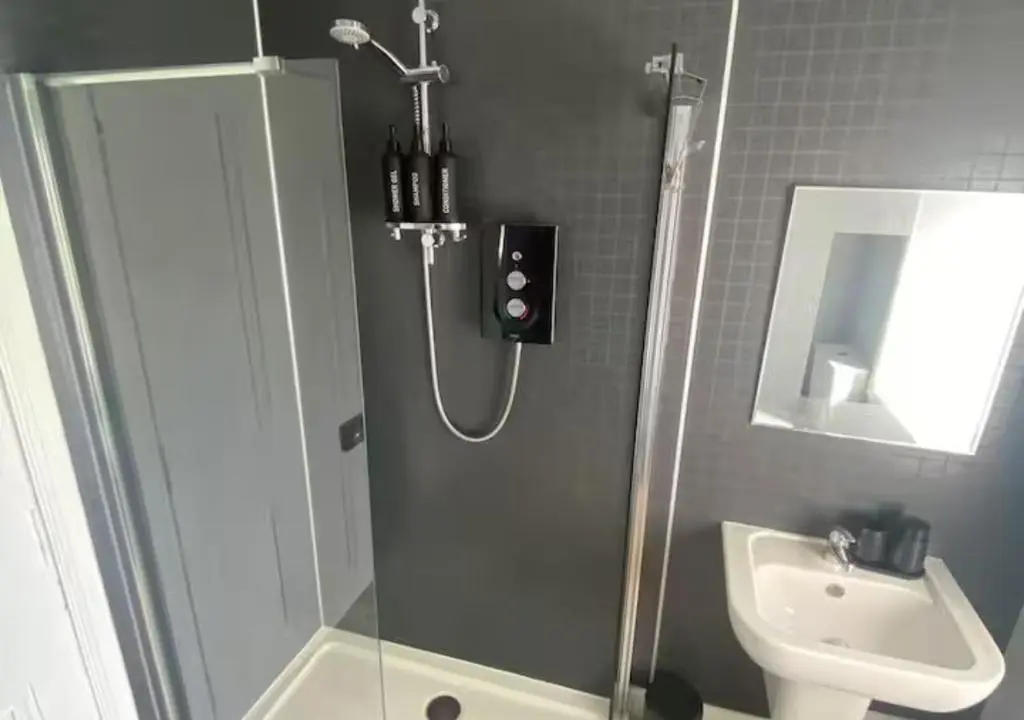 a bathroom with a shower and a sink at Frithside Retreat 3BR Sleeps 7 Coastal Getaway in Fraserburgh