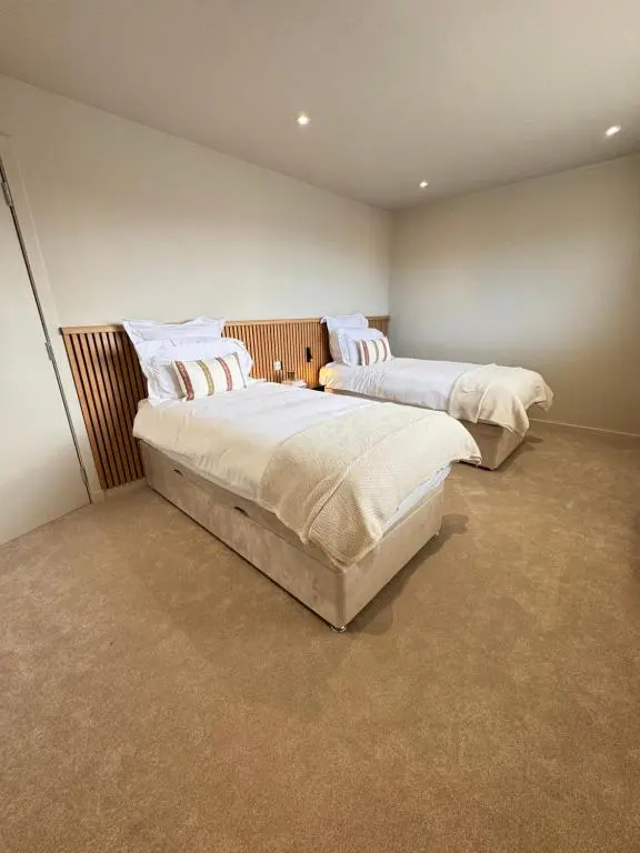 a bedroom with two beds in a room at No 67 West Road in Fraserburgh