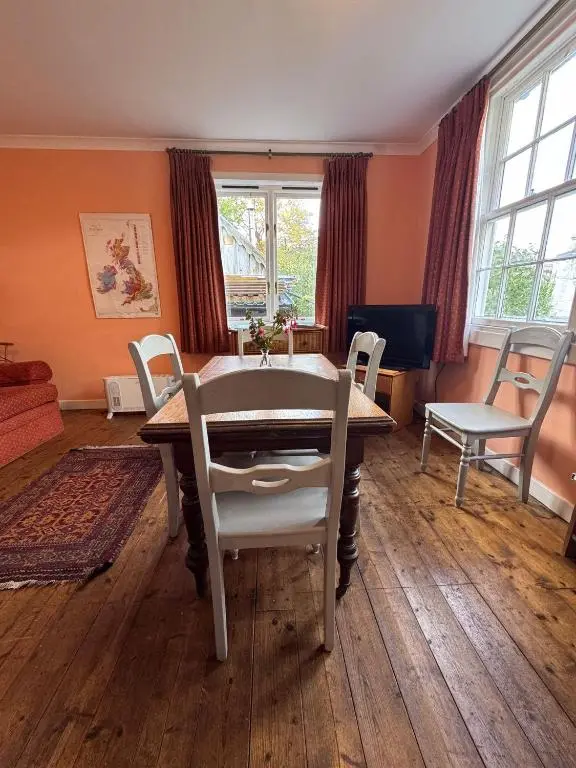 a dining room with a table and chairs at Ullapool Lawyur's patch in Ullapool