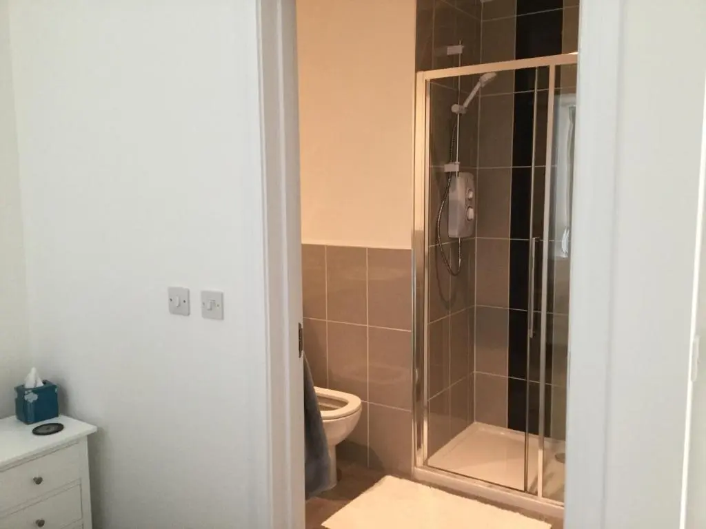 a bathroom with a shower and a toilet at Amazing views of Inverness in Inverness